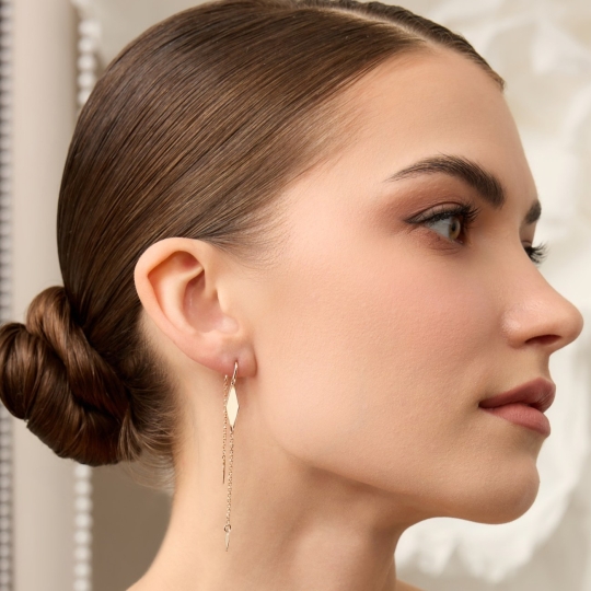 Серьги из золота с бриллиантами и изумрудами 